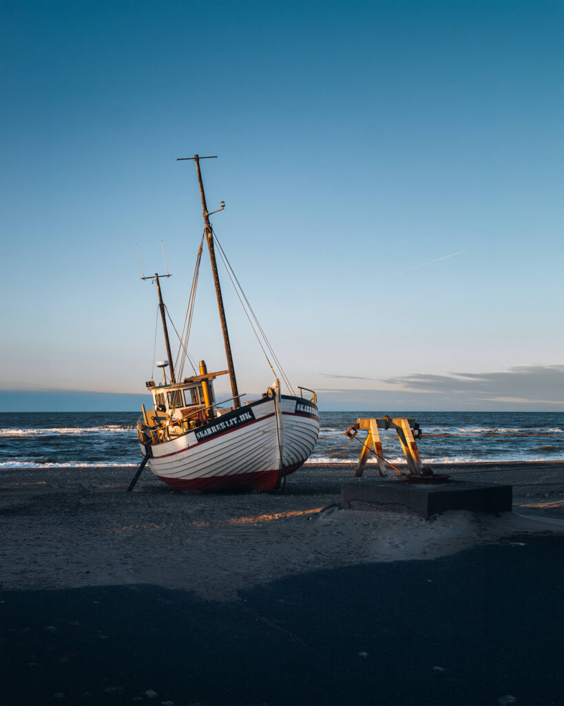 Traditional fishing boat on the beach at Thorup Strand, Denmark